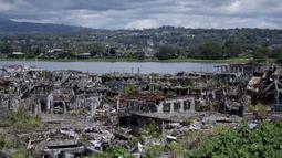 Pemandangan bangunan yang hancur di Kota Marawi, Mindanao, Filipina, 23 Mei 2019. Kota yang sempat dikuasai ISIS tersebut tetap menjadi reruntuhan, para ahli pun memperingatkan bahwa upaya rekonstruksi yang macet memperkuat daya tarik kelompok ekstremis. (Noel CELIS/AFP)