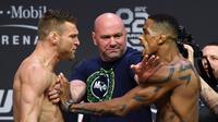 Sesi staredown pada ajang MMA atau tinju biasa berlangsung panas. (AFP/Ethan Miller)