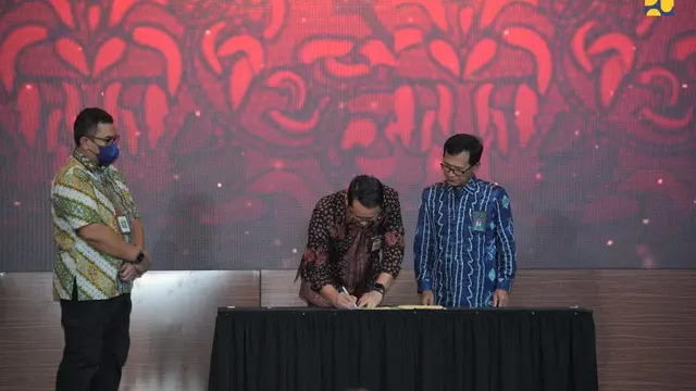 penandatanganan Nota Kesepakatan dan Perjanjian Kerja sama tentang Penyelenggaraan Bantuan Pembangunan Rumah Susun (Rusun) di Audotirum Kementerian PUPR, Jumat (9/12/2022). (Dok Kementerian PUPR)