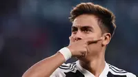 Striker Juventus, Paulo Dybala, merayakan gol yang dicetaknya ke gawang Young Boys pada laga Liga Champions di Stadion Juventus, Turin, Selasa (2/10/2018). Juventus menang 3-0 atas Young Boys. (AFP/Marco Bertorello)