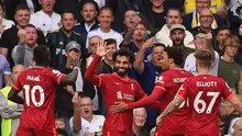 Pemain Liverpool merayakan gol yang dicetak Mohamed Salah ke gawang Leeds United dalam laga pekan keempat Premier League, Minggu (12/9/2021). Gol Mohamed Salah ini menjadi golnya yang ke-100 di Premier League. (OLI SCARFF / AFP)