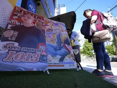 Kemeriahan Ultah Jimin BTS di Kota Seoul. (Foto: (AP Photo/Ahn Young-joon)