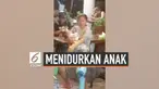 Beredar rekaman gambar yang memperlihatkan seorang wanita yang menidurkan anaknya sambil berjoget. Momen ini terjadi di salah satu restoran di Pratum Thani, Thailand.