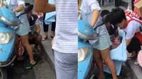 Emak-emak melahirkan bayi di skuter listrik di salah satu jalan raya di kota Hangzhou, China, Selasa (19/9/2017). (Shanghaiist)