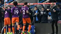 Manajer Manchester City, Pep Guardiola, tak terlalu puas dengan performa anak asuhnya saat menang 3-0 atas Huddersfield Town pada laga pekan ke-23 Premier League, di John Smith's Stadium, Minggu (20/1/2019). (AFP/Paul Ellis)