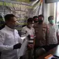 Tersangka pengiriman Pekerja Migran Indonesia Ilegal ketika diperiksa di Polda Kepulauan Riau. (foto: Liputan6.com/ajang Nurdin)