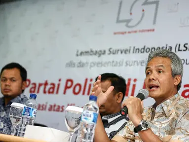 Gubernur Jateng Ganjar Pranowo (kanan) memaparkan pandangannya pada acara Survei Partai Politik di Mata Publik di Jakarta, Minggu (25/1/2015). (Liputan6.com/Faizal Fanani)