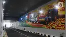 Mural terlihat di Jalan Underpass Dewi Sartika di Depok, Jawa Barat, Selasa (17/1/2023). Pekerjaan underpass Dewi Sartika ini membutuhkan waktu sekitar satu tahun atau mulai dikerjakan pada Februari 2022. (Liputan6.com/Herman Zakharia)