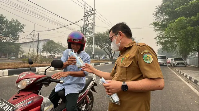 Dinas Kesehatan Kota Palangka Raya menggelar aksi pembagian masker dan suplemen susu gratis kepada masyarakat, Senin (5/10) (Istimewa)