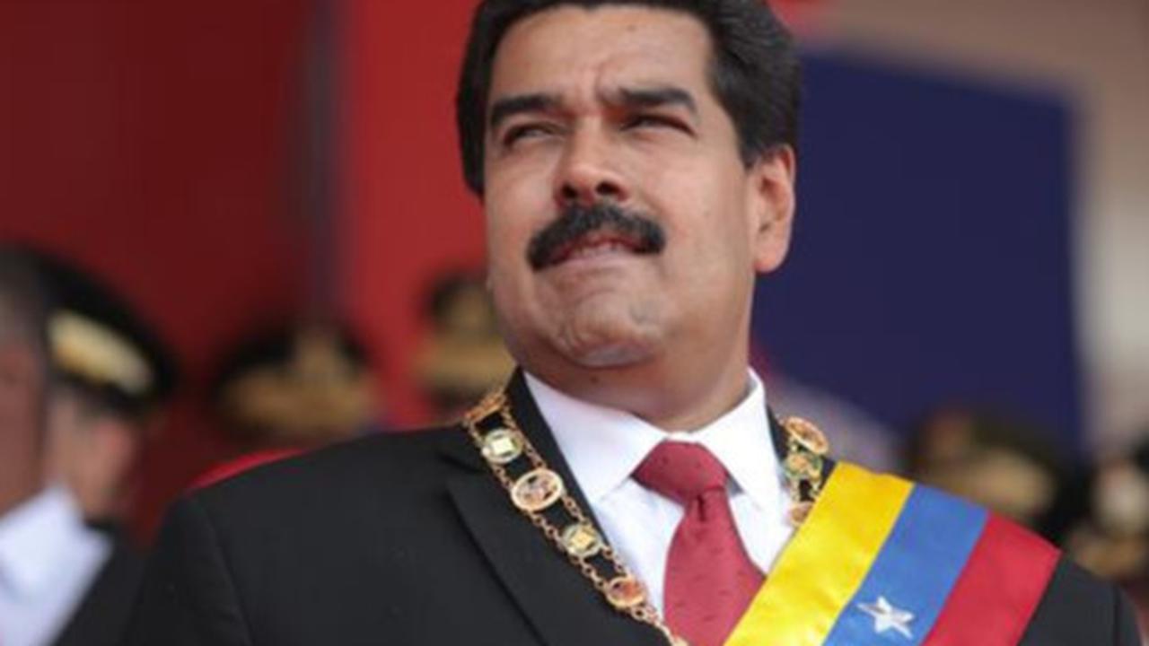 Presiden Nicola Maduro di hadapan rakyat Venezuela - AFP