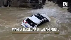 Rekaman penyelamatan dramatis seorang wanita yang terjebak di arus sungai yang deras.