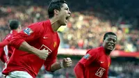 Cristiano Ronaldo of Manchester United celebrates with teammate Patrice Evra after scoring the second goal from the penalty spot during the Premier league football match against Everton at Old Trafford Manchester, 23 December 2007. AFP PHOTO/ANDREW YATES.