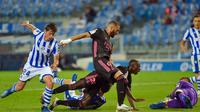 Real Madrid hanya bermain imbang kontra Real Sociedad pada laga pembuka Liga Spanyol, Senin (21/9/2020) dini hari WIB. (ANDER GILLENEA / AFP)