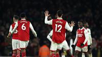 Para pemain Arsenal melakukan selebrasi usai pertandingan sepak bola Liga Inggris antara Arsenal dan Manchester United di stadion Emirates di London, Minggu, 22 Januari 2023. (AP Photo/Ian Walton)