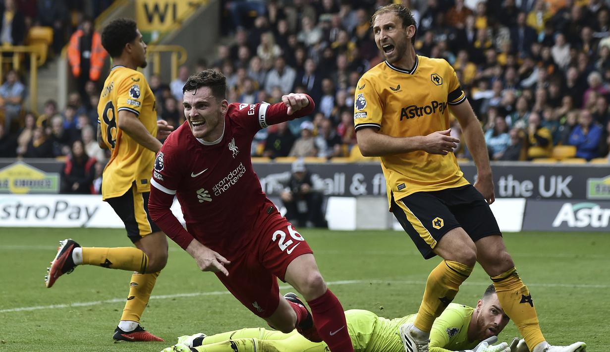 Selebrasi bek Liverpool, Andrew Robertson setelah mencetak gol kedua timnya ke gawang Wolverhampton Wanderers pada laga pekan kelima Premier League 2023/2024 di Molineux Stadium, Wolverhampton, Sabtu (16/9/2023) malam WIB. (AP Photo/Rui Vieira)