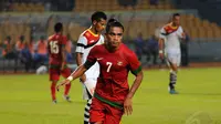 Selebrasi Zulham Manik Zamrun usai menjebol gawang Timor Leste di Stadion GBK Jakarta, Selasa (11/11/2014). (Liputan6.com/Helmi Fithriansyah)