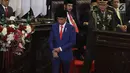 Presiden Joko Widodo atau Jokowi turun dari mimbar usai menyampaikan Pidato Kenegaraan pada Sidang Tahunan MPR 2019 di Kompleks Parlemen, Senayan, Jakarta, Jumat (16/8/2019). Jokowi akan menyampaikan pidato dalam tiga sesi dengan tema yang berbeda selama acara berlangsung. (Liputan6.com/Johan Tallo)