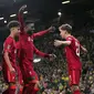 Penyerang Liverpool Divock Origi (tengah) bersama rekan setim merayakan gol yang dicetaknya ke gawang Norwich City pada babak ketiga Piala Liga Inggris di Carrow Road, Rabu (22/9/2021) dinihari WIB. Liverpool sukses menghajar Norwich City tiga gol tanpa balas di kandang lawan (Joe Giddens/PA via AP)