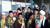 Jemaah umrah asal Indonesia yang dipulangkan lebih awal karena terdampak kebijakan penangguhan sementara akses masuk ke Arab Saudi, Sabtu (29/2/2020). (Ist)