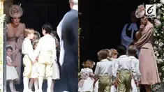 Tak kalah menarik dari Pippa, Kate Middleton tak kalah mempesona menggunakan gaun rancangan Alexander McQueen.