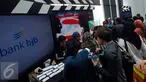 Pengunjung memadati bioskop CGV Blitz Grand Indonesia Jakarta, Sabtu (26/3). Acara nonton bareng Batman Vs Superman : Dawn of Justice disponsori oleh Bank Jabar Banten (BJB). (Liputan6.com/Angga Yuniar)