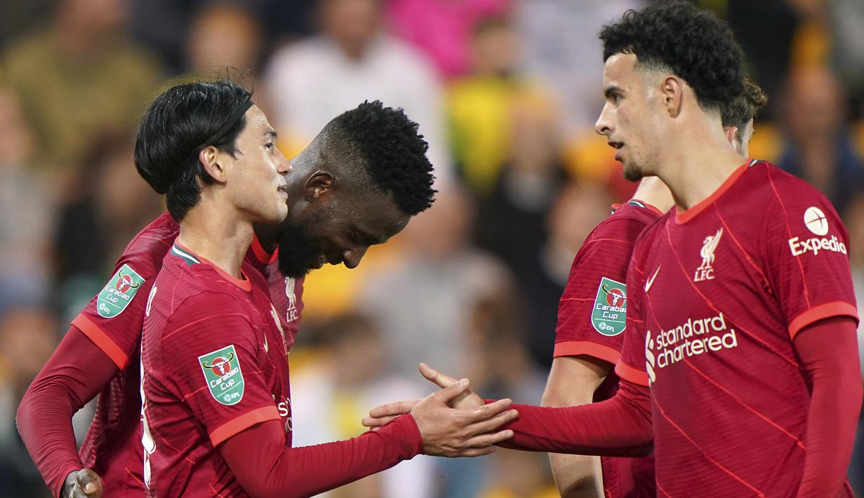 Takumi Minamino mencetak gol keduanya pada menit ke-80 sekaligus membawa Liverpool unggul 3-0. Aksinya melewati seorang bek lawan usai menerima umpan Alex Oxlade-Chamberlain diteruskan dengan sepakan di tiang dekat yang menaklukkan Angus Gunn. Liverpool pun menang 3-0. (PA via AP/Joe Giddens)