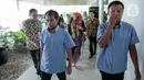 Dua Anak Buah Kapal (ABK) WNI yang berhasil dibebaskan dari penyanderaan Abu Sayyaf di Filipina tiba di Kementerian Luar Negeri RI, Jakarta, Kamis (26/12/2019). Maharudin Lunani (48) dan Samiun Maneu (27)  diserahkan kepada keluarga oleh Menteri Luar Negeri Retno Marsudi (Liputan6.com/Faizal Fanani)
