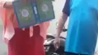 Tangkapan layar wanita Makassar hendak robek Al-Qur'an (Istimewa)