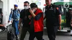Tersangka suap, Erintuah Damanik—Ketua Majelis Hakim pada Pengadilan Negeri Surabaya yang menyidangkan kasus penganiayaan yang menewaskan Dini Sera Afrianti dengan terdakwa Gregorius Ronald Tannur—saat tiba di gedung Kejaksaan Agung (Kejagung) RI, Jakarta, Selasa (5/11/2024). (Liputan6.com/Angga Yuniar)