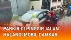 Dua mobil parkir sembarangan bikin susah mobil Damkar melintas.