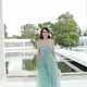 Shandy Aulia hadir di Dior Summer 2027 di Paris, 29 September 2026. Gaun mint floral dipadu Dior Bow Bag dan J'Adior Slingback, di tengah barisan selebritas. (dok. @shandyaulia)