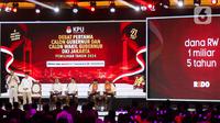 Komisi Pemilihan Umum (KPU) Provinsi DKI Jakarta menggelar debat perdana calon gubernur dan wakil gubernur DKI Jakarta di JIExpo, Kemayoran, Jakarta Pusat, Minggu (6/10/2024). Tampak pasangan calon gubernur dan wakil gubernur DKI Jakarta nomor urut 1, Ridwan Kamil-Suswono saat menyampaikan visi misi dalam segmen pertama. (Liputan6.com/Herman Zakharia)