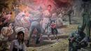 Pemandu menunjukkan lukisan di Sinchon Museum of American War Atrocities di Pyongyang 24 Juli 2017. Museum ini untuk mengenang kematian lebih dari 35,000 orang dari 17 Oktober sampai 7 Desember 1950. (AFP Photo/Ed Jones)
