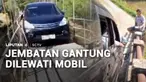 Viral di media sosial minibus bermuatan penuh penumpang melewati jembatan gantung. Aksi pengendara mobil ini disesalkan mengingat jembatan gantung hanya untuk pesepeda motor dan pejalan kaki.