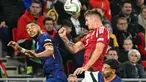 Penyerang Belanda, Cody Gakpo (kiri) berebut bola atas dengan gelandang Hungaria, Tamas Nikitscher saat pertandingan matchday 3 Grup C UEFA Nations League A 2024/2025, di Puskas Arena, Budapest, Jumat 11 Oktober 2024 atau Sabtu 12 Oktober 2024 dini hari WIB. (Attila KISBENEDEK/AFP)