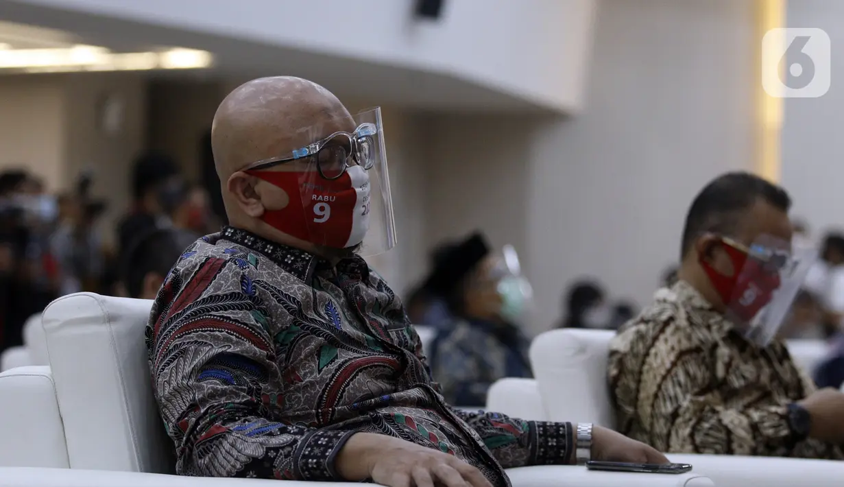 Komisioner KPU RI Ilham Saputra saat Launching Pemilihan Serentak Tahun 2020 di Gedung KPU RI, Menteng, Jakarta Pusat, Kamis (18/6/2020). Tahapan Pilkada Serentak 2020 kembali dimulai setelah sempat tertunda karena pandemi COVID-19. (Liputan6.com/Johan Tallo)