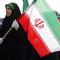 Beberapa perempuan membawa Bendera Iran di Ibu Kota Teheran. (c) AFP/Begriyz Negr