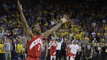 Ekspresi Kawhi Leonard pebasket andalan Toronto Raptors merayakan titel juara NBA pertama bagi klub Raptors. Di gim keenam ia berhasil mencetak 22 poin. (AP Photo/Ben Margot)