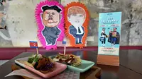 Makanan taco bernama El Trumpo (kanan) dan Rocket Man dihidangkan restoran Lucha Loco  di Singapura, 7 Juni 2018. Makanan itu memanfaatkan momentum pertemuan Donald Trump dan Pemimpin Korea Utara Kim Jong-un di Singapura 12 Juni nanti. (AFP/ROSLAN RAHMAN)