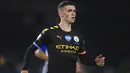 Pemain Manchester City, Phil Foden, saat melawan Brighton and Hove Albion pada laga Premier League di Stadion Falmer, Sabtu (11/7/2020). Manchester City menang 5-0. (Adam Davy/Pool via AP)