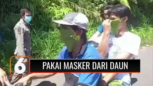 Ada saja aksi menggelitik warga Indonesia. Demi menghindari razia, dua warga ini gunakan daun sebagai masker penutup hidung dan mulut agar bisa lolos dari pos penyekatan.