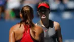 Petenis Kanada, Eugenie Bouchard bersalaman dengan petenis Rusia Evgeniya Rodina usai pertandingan di AS Terbuka 2017 di USTA Billie Jean King National Tennis Center, New York (30/8). Bouchard kalah 7-6 (2), 6-1. (AFP Photo/Eduardo Munoz Alvarez)