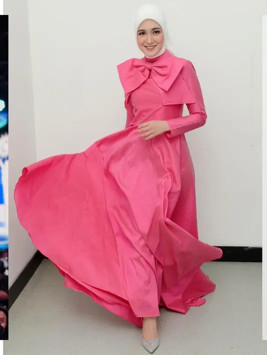 Cut Syifa memakai dress warna shocking pink dengan aksen pita besar yang menjadi pernyataan gaya rancangan Renzi Lazuardi [Instragam @cutsyifaa]
