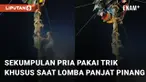 Trik khusus ditunjukkan oleh sekumpulan pria ini saat ikuti lomba panjat pinang menarik perhatian