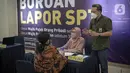 Petugas melayani wajib pajak yang melaporkan SPT tahunan di KPP Pratama Jakarta Tanah Abang Tiga, Jakarta, Kamis (31/3/2022). Wajib pajak terpantau ramai datang berkunjung KPP Pratama Jakarta Tanah Abang Tiga. (Liputan6.com/Faizal Fanani)