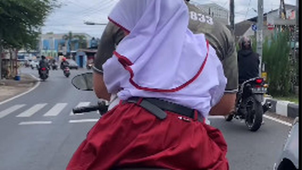 Sederhana Tapi Luar Biasa, Cara Anggota TNI Hibur Putri Kecilnya saat Naik Motor di Lampu Merah ini Bikin Senyum-Senyum Sendiri