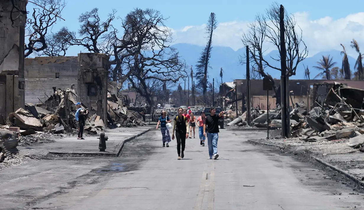 Menurut laporan Reuters, angka korban jiwa itu masih memungkinkan untuk bertambah seiring tim terus menyisir reruntuhan kota yang hangus dengan bantuan anjing pelacak. (AP Photo/Rick Bowmer)