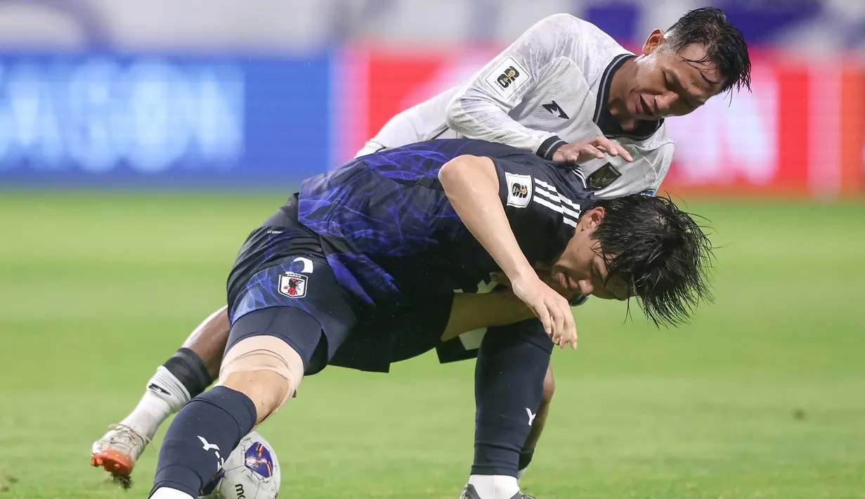 Sempat memberikan perlawanan sengit, Timnas Indonesia akhirnya tertinggal jauh dari Jepang. (PAUL MILLER/AFP)