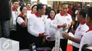 Presiden Joko Widodo didampingi Ibu Negara Iriana Jokowi saat menghadiri acara peringatan Hari Anti Narkotika Internasional (HANI) di kawasan Taman Sari, Jakarta, Minggu (26/6). (Liputan6.com/Herman Zakharia)