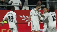 Para pemain Real Madrid merayakan gol ke gawang Girona pada leg kedua perempat final Copa del Rey, di Municipal de Montilivi, Girona, Kamis (31/1/2019). (AFP/Pau Barrena)